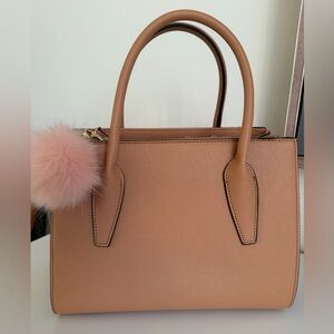 Elegant Tan Handbag with Pink Pom Pom
